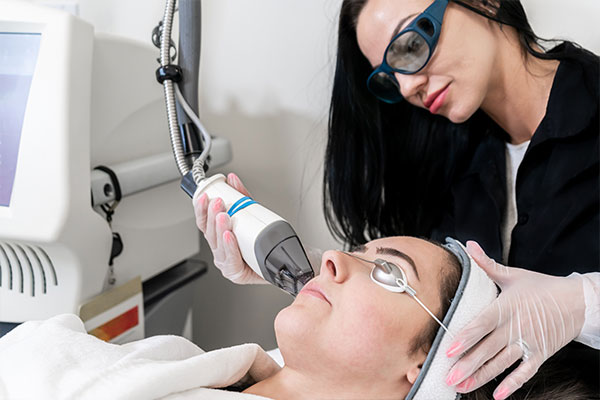 Woman receiving laser skincare treatment in columbus